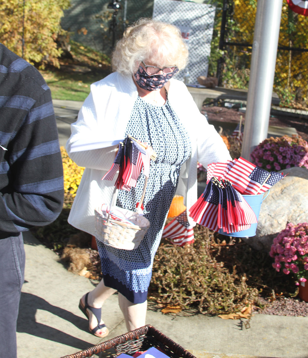 Brenda Adams handed out poppies and American flags.