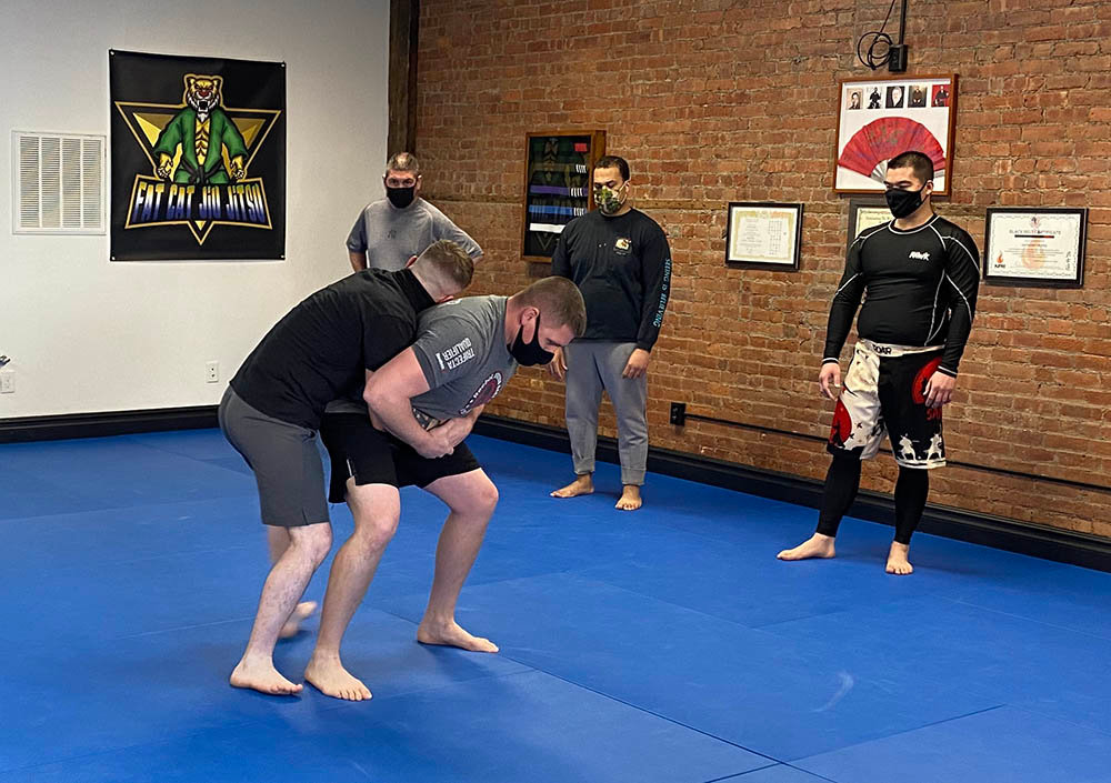 Mike Smith (left), a police officer in Rockland County, exhibits a takedown during a demonstration of the Town of Montgomery Police Department’s defense tactics training course on Thursday at Fat Cat Jiu Jitsu.