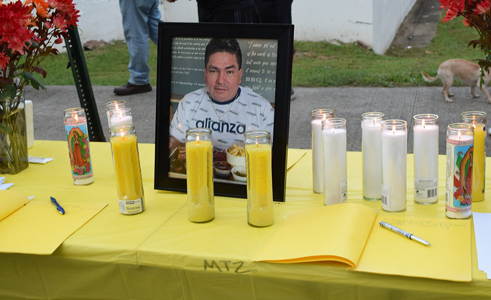 Flowers, candles and a framed photo of Jorge Arbayza De La Cruz, were present, Saturday at a vigil in his honor.