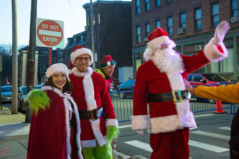 Santa and a pair of elves greeted the crowd on Broadway.