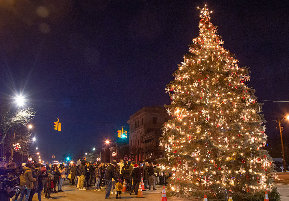 A crowd gathered at the foot of Broadway last Friday for the lighting of the city’s Christmas tree. It was donated by Humberto and Linda Alvarez of the Town of New Windsor. The tree was transported by Michael Bigg, Jr. and Quality Towing, along with their crane operator, John Ammirati, who has been installing the tree in the City of Newburgh for more than two decades. It was decorated by the city’s DPW.