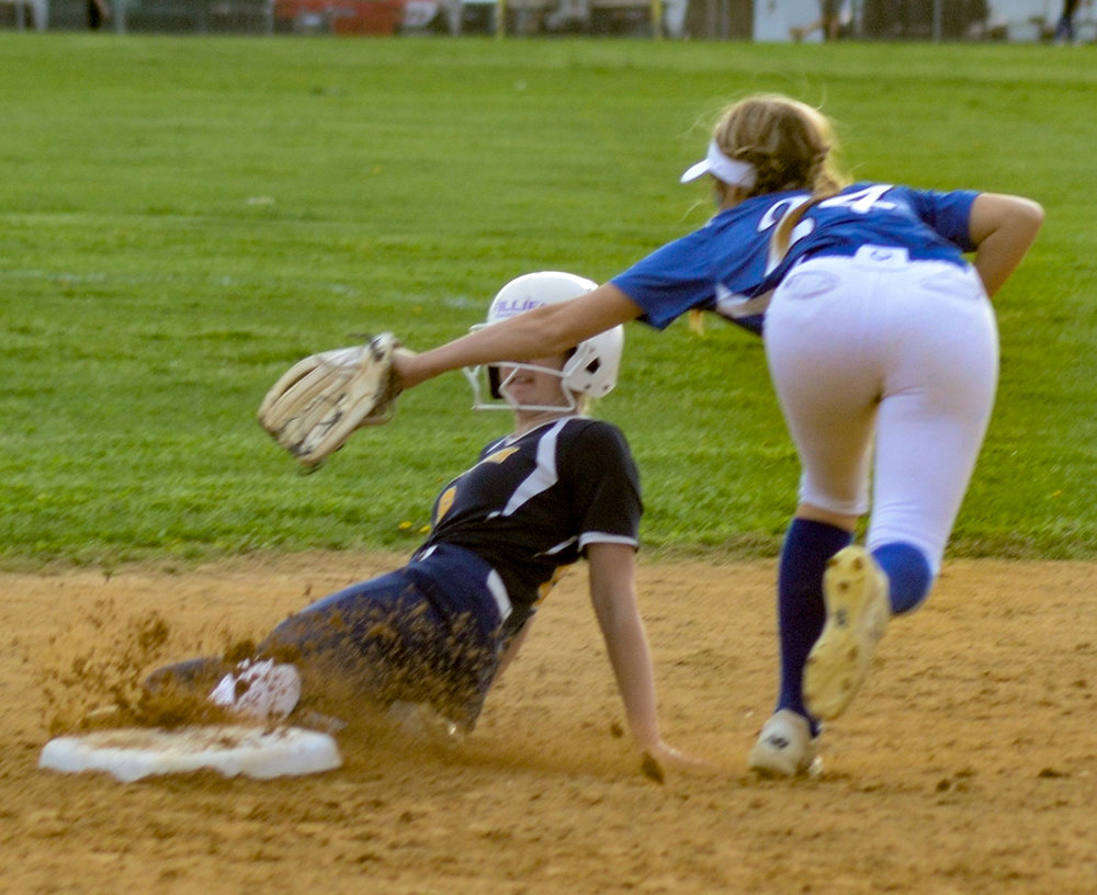 Pine Bush’s Kate Greer slides under the tag of Valley Central shortstop Emilia Brundage during Thursday’s OCIAA Division II softball game at Valley Central High School in Montgomery.
