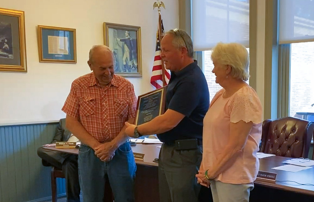 Skip Chambers (l.) was honored at last week’s Montgomery Village Board meeting. He is shown with Mayor Steve Brescia (c) and Trustee Darlene Andolsek.