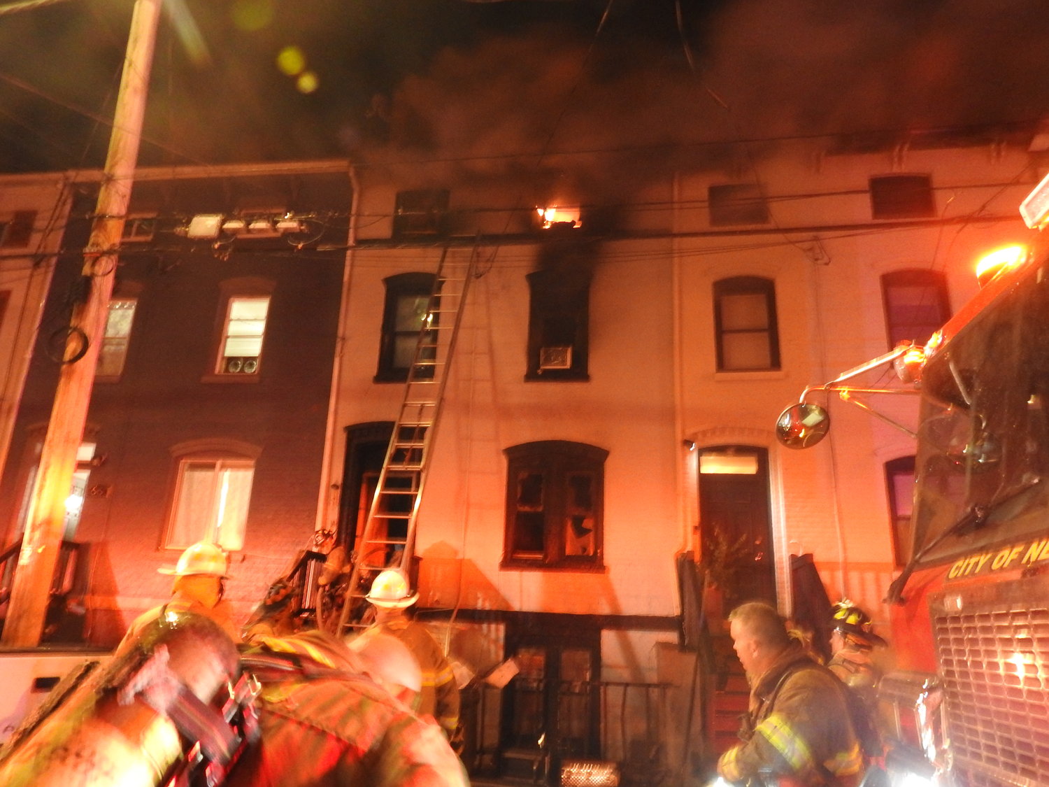 Firefighters battling a fire at 68 Lander Street in the City of Newburgh