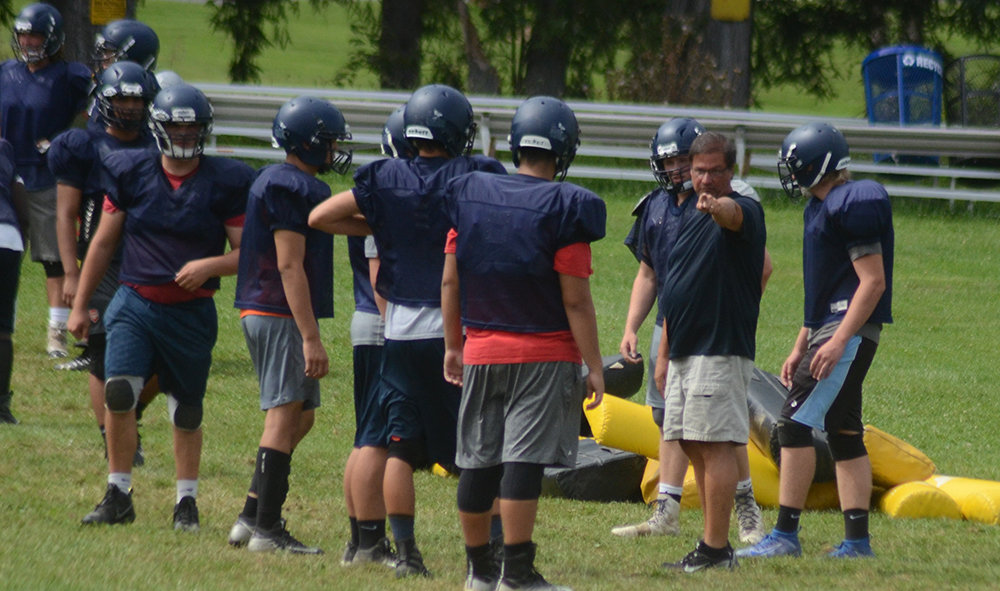 Pine Bush coach Jim Wright instructs his players at the beginning of practice on Aug. 27, 2019.