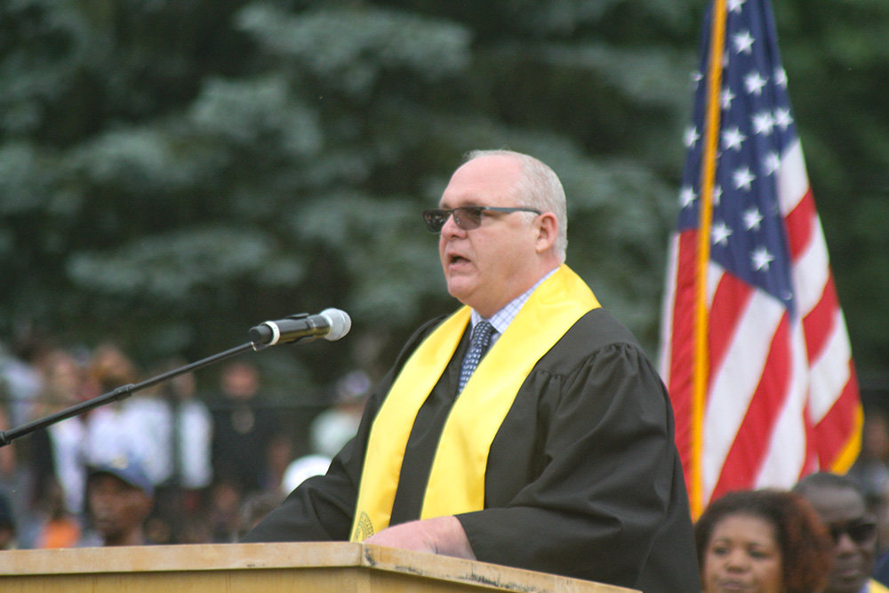 Acting Superintendent Ed Forgit asked the graduates to stand and applaud their families and supporters who got them there.