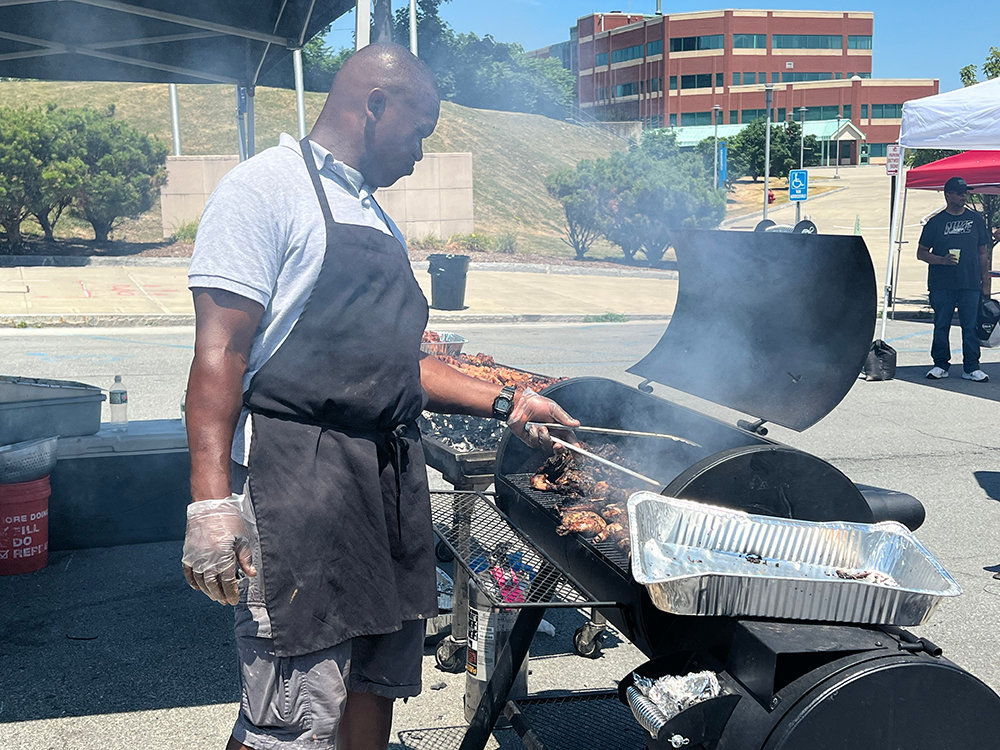 Chicken and other foods are being cooked by the Reggae Boy Cafe food truck during the course of the day for the residents of the City of Newburgh.
