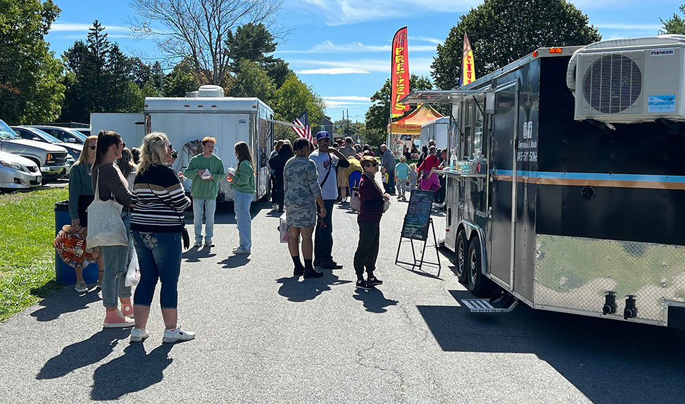 Food trucks line along the top of the hill at Bradley Park.