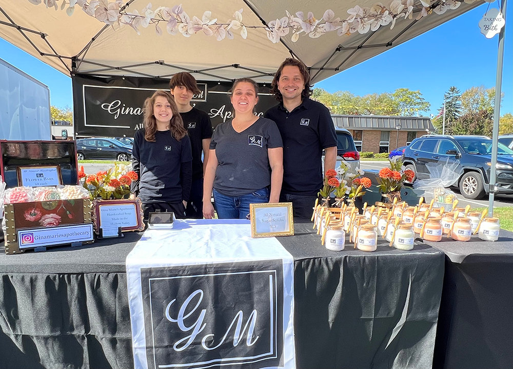 [L-R] Spencer, Hunter, Gina and Daniel Olsen welcome you to their booth to check out their handmade soaps and other products.