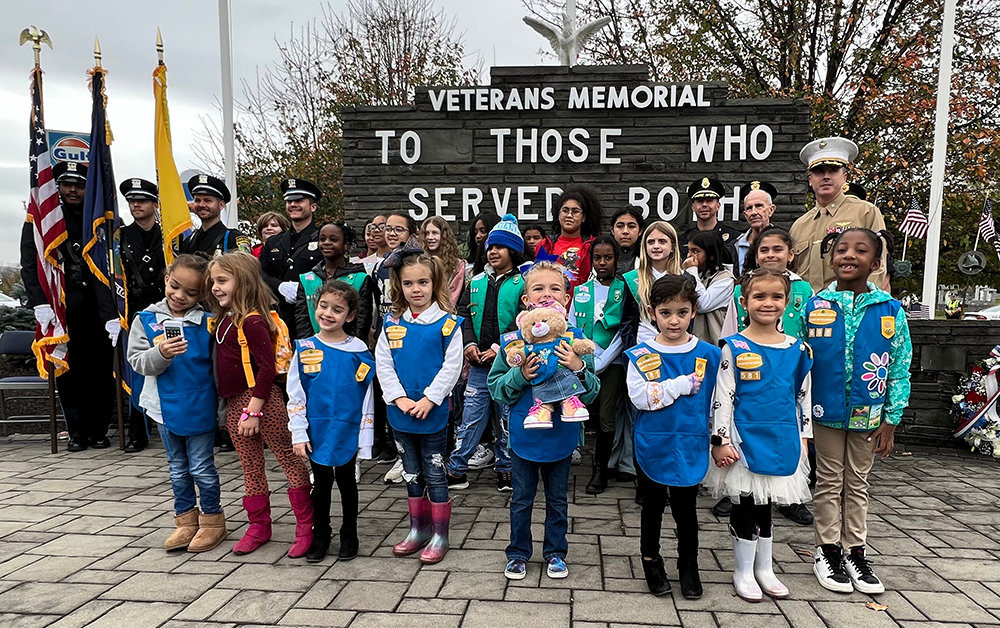 The New Windsor Girl Scouts join the New Windsor Police, Lt. Col. Timothy Gallagher and Town Supervisor George Meyers for a brief photo.
