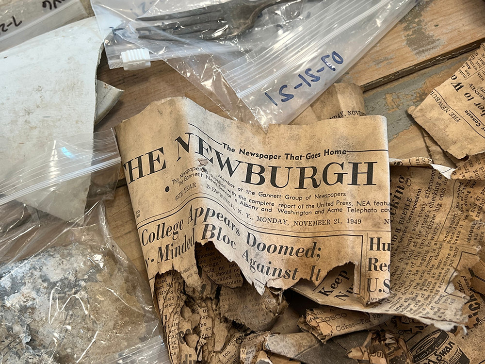 Newspaper clippings that once served as insulation in the tavern.