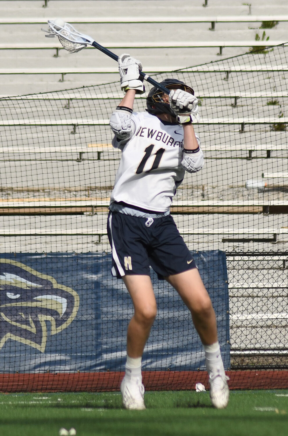 Newburgh's Sam Esposito shoots the ball during Friday's Section 9 boys' lacrosse game at Academy Field in Newburgh.