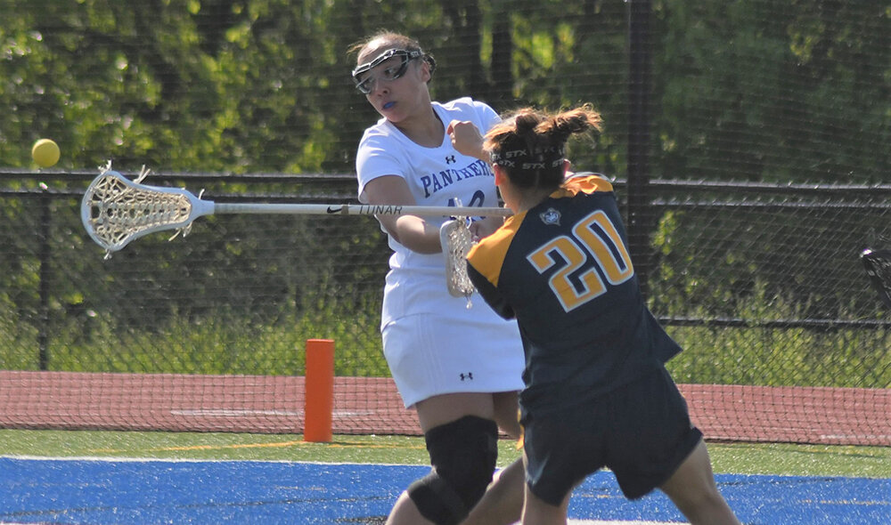 Wallkill's Jazmin Medina shoots the ball as Highland's Jessica Rendon defends during Thursday's non-league girls' lacrosse game at Wallkill High School.