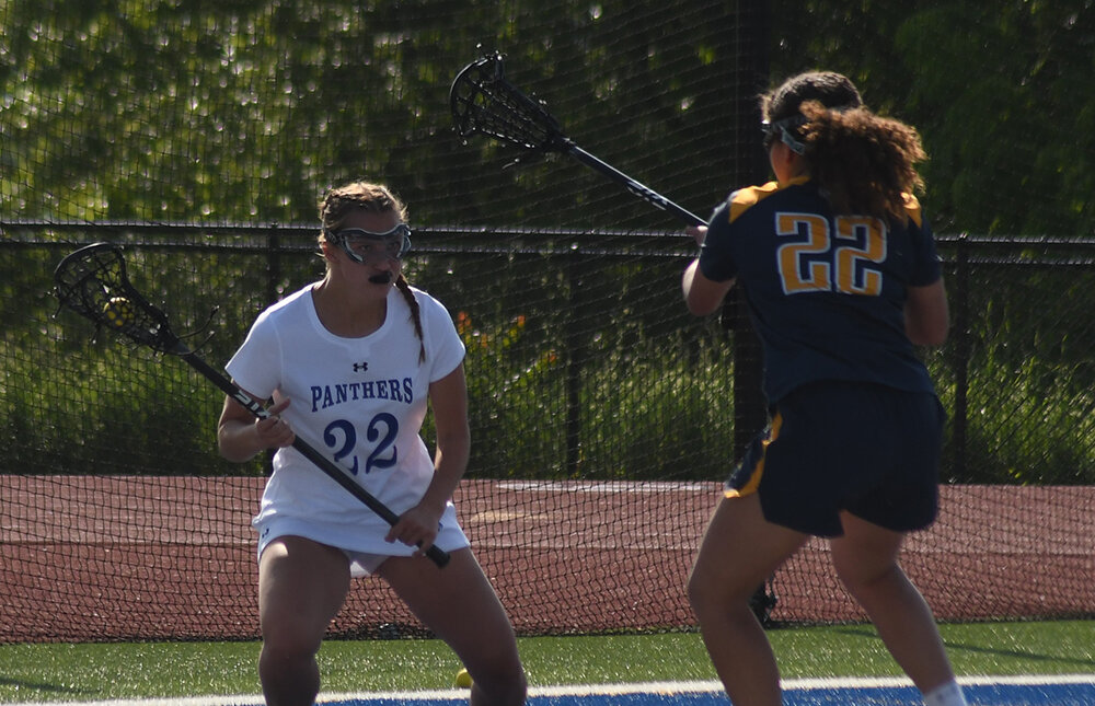 Wallkill's Grace Winchell brings the ball out of he back as Highland's Hope Williams defends during Thursday's non-league girls' lacrosse game at Wallkill High School.