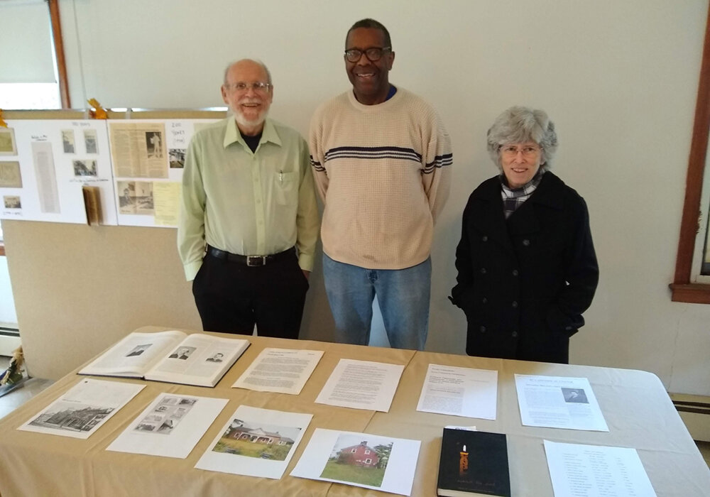 L - r: Pastor Philips Shafer, Former Pastor Charles Leach, Pastor Ernie Johnson looking over historical church documents.