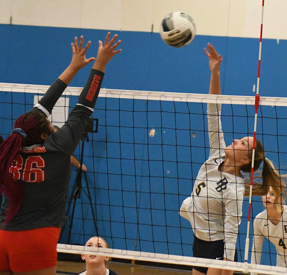 Pine Bush's Taylor Jennings sends the ball over the net as  North Rockland's Ziacera Sexton defends during Wednesday's NYSPHSAA Class AAA subregional at Wallkill High School.
