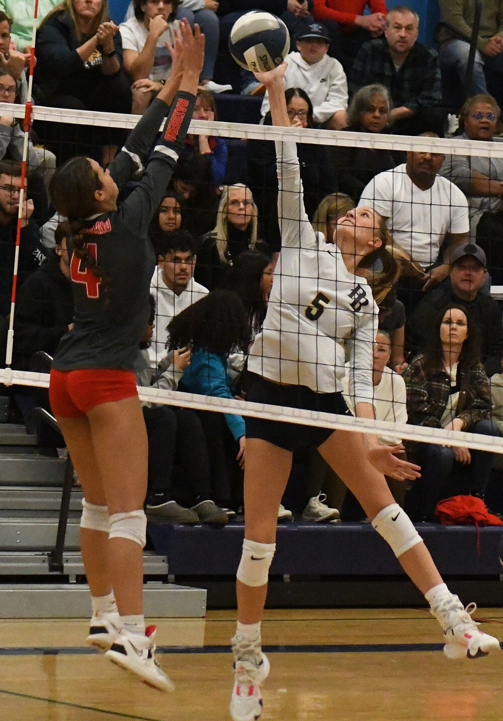Pine Bush's Taylor Jennings hits the ball over the net as North Rockland's Desirae Hernandez defends during Wednesday's NYSPHSAA Class AAA subregional at Wallkill High School.