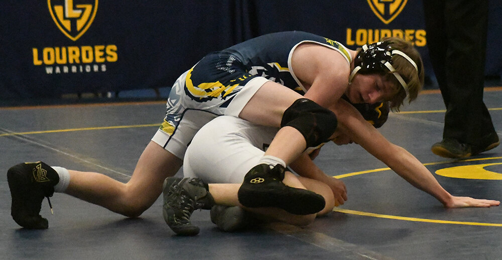 Highland’s Tucker Vett controls Our Lady of Lourdes’ Kaden Mora during a 101-pound bout at a league wrestling match on Jan. 30 at Our Lady of Lourdes High School in Poughkeepsie.